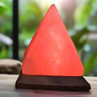 Pyramid-shaped Himalayan Salt Lamp with wooden base and multicolor LED glow