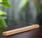 Natural bamboo incense holder with minimalist design and wood grain texture