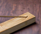 Natural bamboo incense holder with minimalist design and wood grain texture