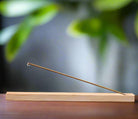 Natural bamboo incense holder with minimalist design and wood grain texture
