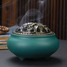 Ceramic Buddha incense burner with antique copper lid, perfect for sticks, cones, or coils. Enhances meditation, rituals, and home décor.