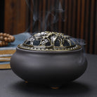 Ceramic Buddha incense burner with antique copper lid, perfect for sticks, cones, or coils. Enhances meditation, rituals, and home décor.