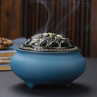 Ceramic Buddha incense burner with antique copper lid, perfect for sticks, cones, or coils. Enhances meditation, rituals, and home décor.