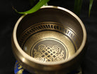 Handmade copper Buddha singing bowl with leather striker and auspicious knot design