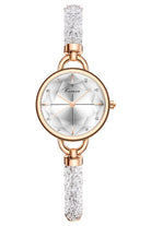 Watch with peal white dial and beaded strap with rose gold case on white background.