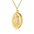 Gold pendant necklace with a religious design on a white background