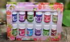Box of 12 aromatherapy oil bottles featuring floral and fruity scents