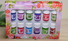 Box of 12 aromatherapy oil bottles featuring floral and fruity scents