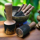 Buddha sound bowl with wooden striker used for meditation and healing