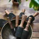 Buddha sound bowl with wooden striker used for meditation and healing