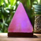 Pyramid-shaped Himalayan Salt Lamp with wooden base and multicolor LED glow