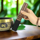 Buddha sound bowl with wooden striker used for meditation and healing