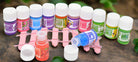 Box of 12 aromatherapy oil bottles featuring floral and fruity scents