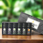 Bottle of herbal massage essential oil with natural ingredients like mint and lavender