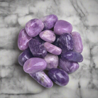 Tumbled Lepidolite healing crystals in polished purple geometric shapes, 100g