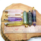 Unisex natural crystal pendant perfume bottle with geometric design, perfect for carrying essential oils or fragrances for peace and mindfulness.