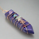 "Crystal chakra pendant symbolizing alignment and strength."